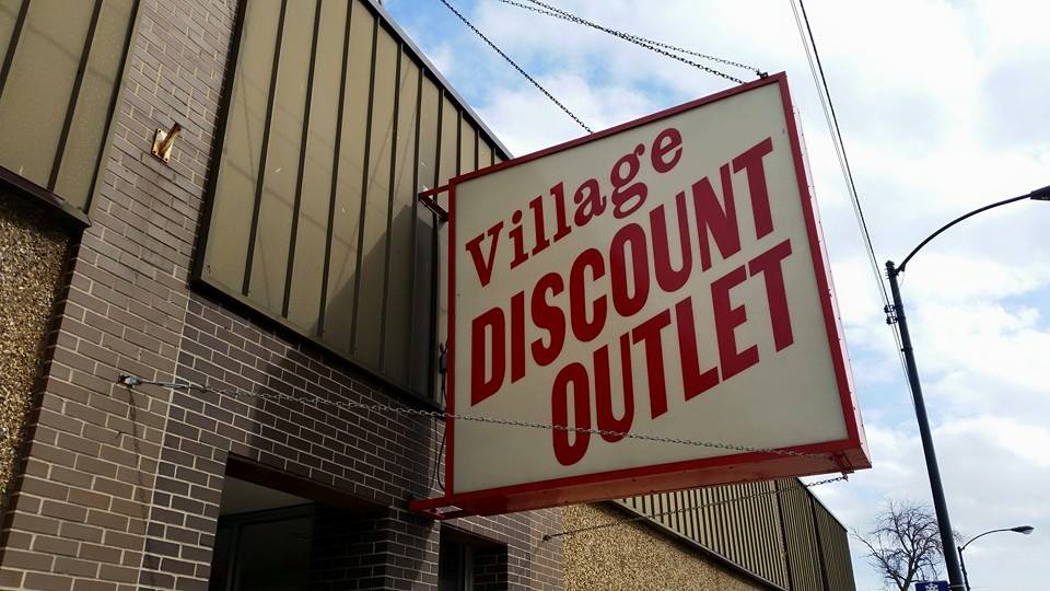 Village Discount Outlet sign outside of thrift store