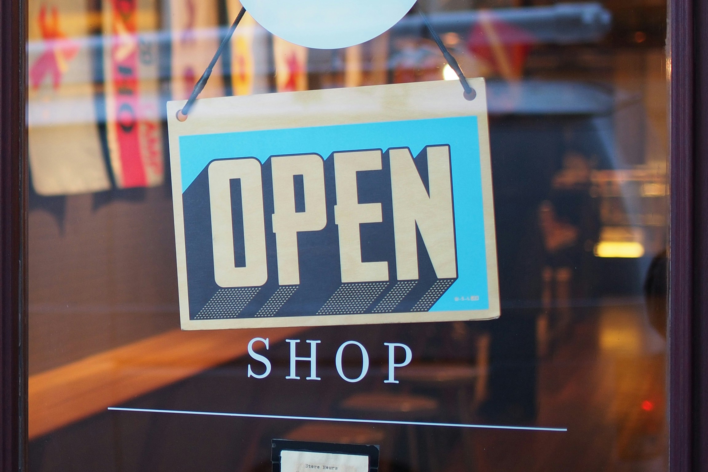 consignment shop with an open sign displayed, embracing can i sell my clothes to a thrift store