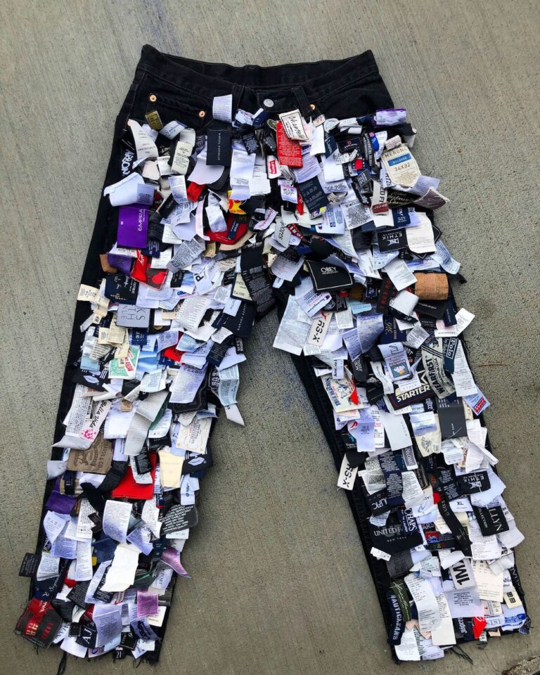 black pair of pants covered in eco friendly clothing tags