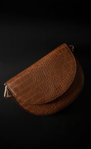 designer handbag on dark background