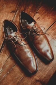 Secondhand dress shoes polished to perfection, supporting thrift store outfit ideas
