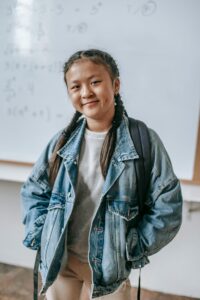 girl wearing denim jacket , embracing thrift store outfit ideas