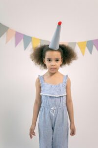 kid wearing party outfit with playful details