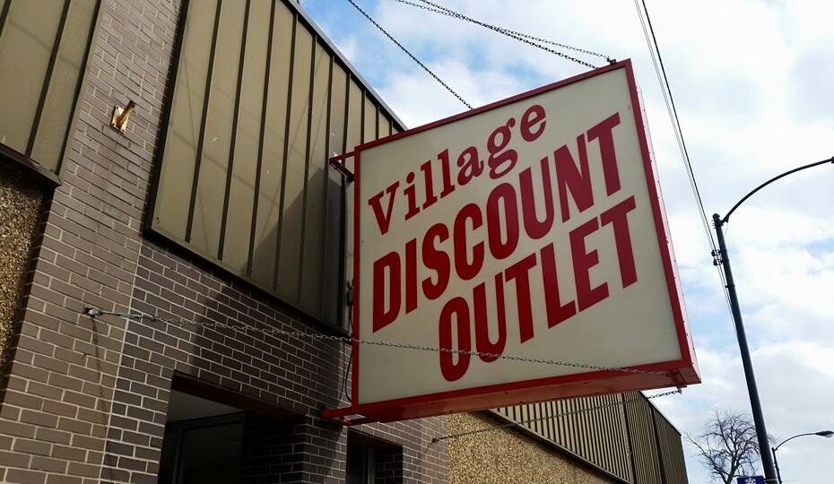 Village Discount Outlet sign outside of thrift store
